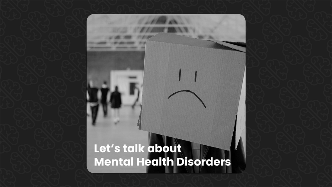 Sad face on a cardboard box with the text "Let's talk about Mental Health Disorders"